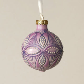 Intricately carved and glazed ceramic globe ornament with ivory satin ribbon –