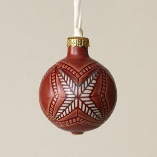 Intricately carved and glazed ceramic globe ornament with ivory satin ribbon –