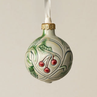 Intricately carved and glazed ceramic globe ornament with ivory satin ribbon –