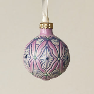 Intricately carved and glazed ceramic globe ornament with ivory satin ribbon –