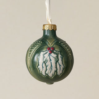 Intricately carved and glazed ceramic globe ornament with ivory satin ribbon –