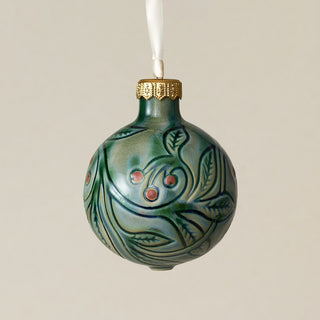 Intricately carved and glazed ceramic globe ornament with ivory satin ribbon –
