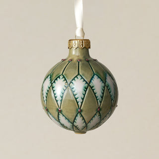 Intricately carved and glazed ceramic globe ornament with ivory satin ribbon –