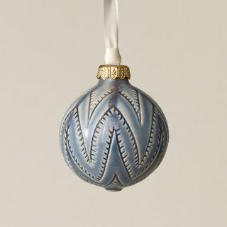 Intricately carved and glazed ceramic globe ornament with ivory satin ribbon –