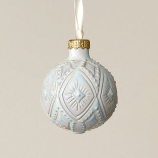 Intricately carved and glazed ceramic globe ornament with ivory satin ribbon –