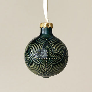 Intricately carved and glazed ceramic globe ornament with ivory satin ribbon – Ornament No. 253