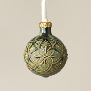Intricately carved and glazed ceramic globe ornament with ivory satin ribbon – Ornament No. 257