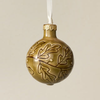 Intricately carved and glazed ceramic globe ornament with ivory satin ribbon – Ornament No. 259