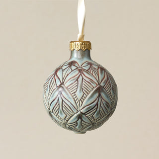 Intricately carved and glazed ceramic globe ornament with ivory satin ribbon – Ornament No. 266