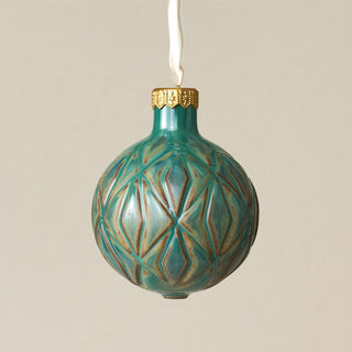 Intricately carved and glazed ceramic globe ornament with ivory satin ribbon – Ornament No. 268