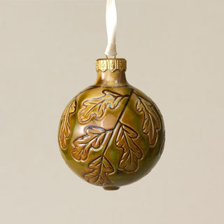 Intricately carved and glazed ceramic globe ornament with ivory satin ribbon – Ornament No. 269