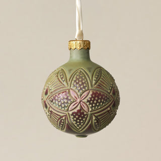 Intricately carved and glazed ceramic globe ornament with ivory satin ribbon – Ornament No. 273