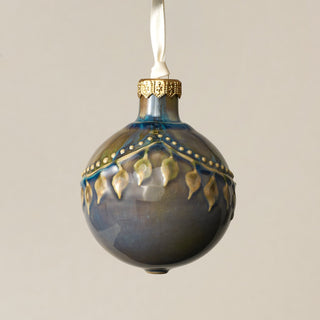 Intricately carved and glazed ceramic globe ornament with ivory satin ribbon – Ornament No. 274