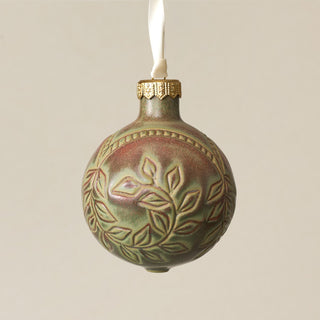 Intricately carved and glazed ceramic globe ornament with ivory satin ribbon – Ornament No. 275