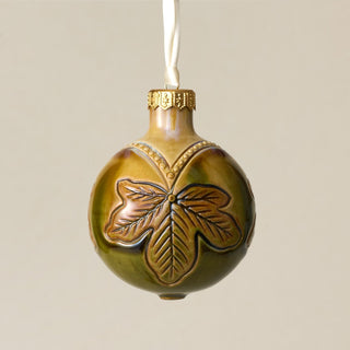 Intricately carved and glazed ceramic globe ornament with ivory satin ribbon – Ornament No. 276