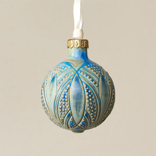 Intricately carved and glazed ceramic globe ornament with ivory satin ribbon – Ornament No. 278
