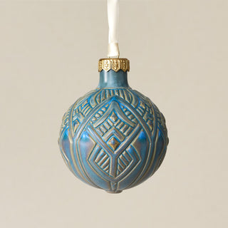 Intricately carved and glazed ceramic globe ornament with ivory satin ribbon – Ornament No. 279