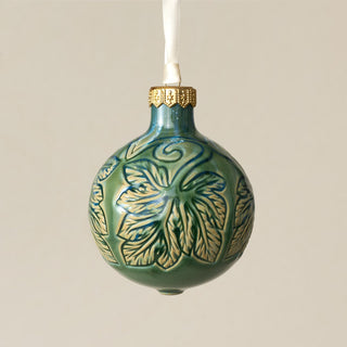 Intricately carved and glazed ceramic globe ornament with ivory satin ribbon – Ornament No. 280