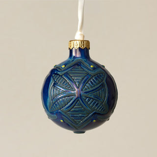 Intricately carved and glazed ceramic globe ornament with ivory satin ribbon – Ornament No. 282