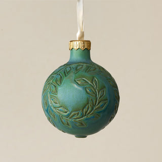Intricately carved and glazed ceramic globe ornament with ivory satin ribbon – Ornament No. 283