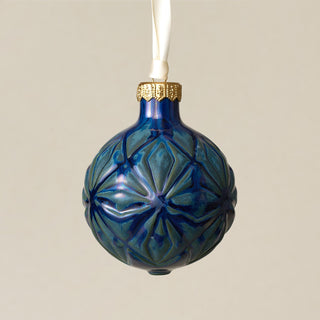 Intricately carved and glazed ceramic globe ornament with ivory satin ribbon – Ornament No. 303