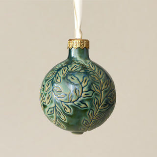 Intricately carved and glazed ceramic globe ornament with ivory satin ribbon – Ornament No. 305