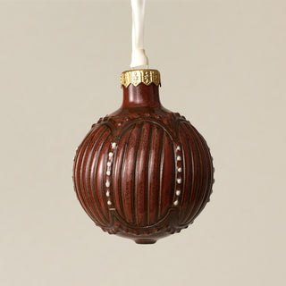 Intricately carved and glazed ceramic globe ornament with ivory satin ribbon – Ornament No. 311