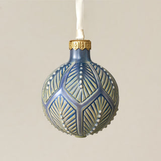 Intricately carved and glazed ceramic globe ornament with ivory satin ribbon – Ornament No. 323