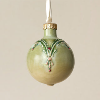 Intricately carved and glazed ceramic globe ornament with ivory satin ribbon – Ornament No. 344