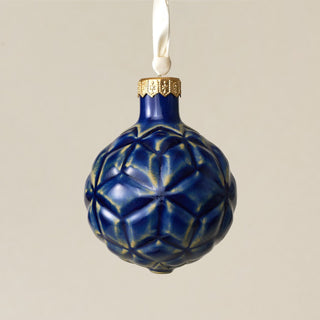 Intricately carved and glazed ceramic globe ornament with ivory satin ribbon – Ornament No. 345
