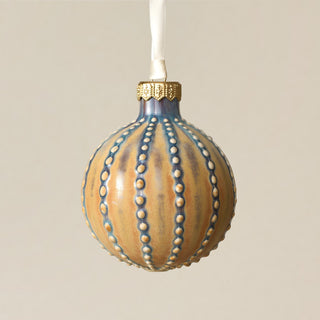 Intricately carved and glazed ceramic globe ornament with ivory satin ribbon – Ornament No. 362