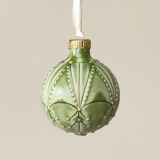 Intricately carved and glazed ceramic globe ornament with ivory satin ribbon – Ornament No. 377