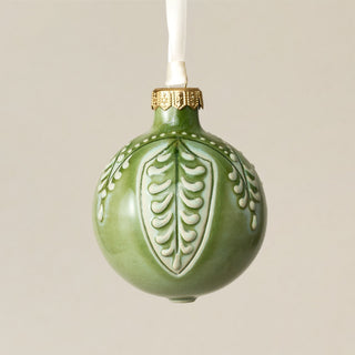 Intricately carved and glazed ceramic globe ornament with ivory satin ribbon – Ornament No. 382
