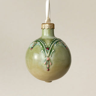 Intricately carved and glazed ceramic globe ornament with ivory satin ribbon – Ornament No. 388