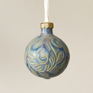 Intricately carved and glazed ceramic globe ornament with ivory satin ribbon – Ornament No. 394