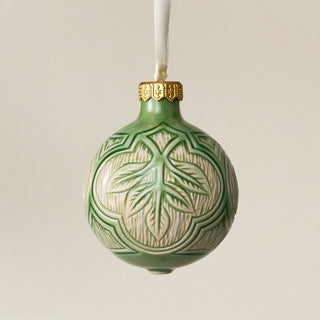 Intricately carved and glazed ceramic globe ornament with ivory satin ribbon – Ornament No. 395