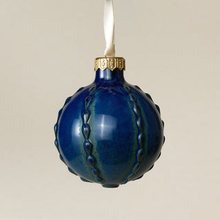 Intricately carved and glazed ceramic globe ornament with ivory satin ribbon – Ornament No. 397