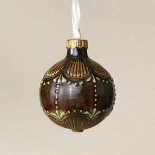 Intricately carved and glazed ceramic globe ornament with ivory satin ribbon – Ornament No. 404