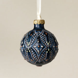 Intricately carved and glazed ceramic globe ornament with ivory satin ribbon – Ornament No. 409