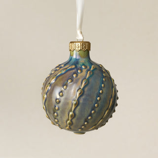 Intricately carved and glazed ceramic globe ornament with ivory satin ribbon – Ornament No. 413