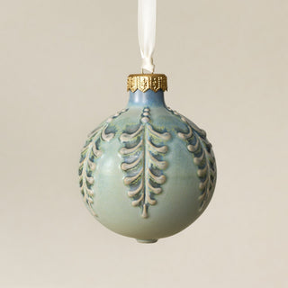 Intricately carved and glazed ceramic globe ornament with ivory satin ribbon – Ornament No. 414