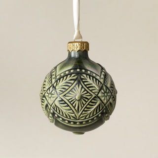 Intricately carved and glazed ceramic globe ornament with ivory satin ribbon – Ornament No. 419