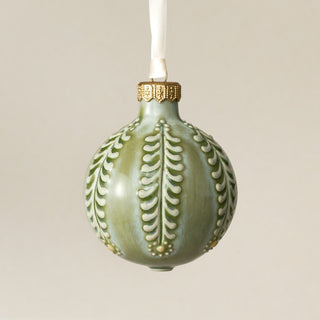 Intricately carved and glazed ceramic globe ornament with ivory satin ribbon – Ornament No. 420