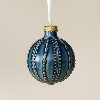 Intricately carved and glazed ceramic globe ornament with ivory satin ribbon – Ornament No. 424