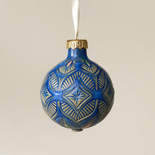 Intricately carved and glazed ceramic globe ornament with ivory satin ribbon – Ornament No. 431