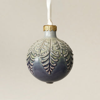 Intricately carved and glazed ceramic globe ornament with ivory satin ribbon – Ornament No. 441
