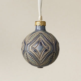 Intricately carved and glazed ceramic globe ornament with ivory satin ribbon – Ornament No. 442