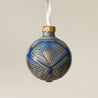 Intricately carved and glazed ceramic globe ornament with ivory satin ribbon – Ornament No. 443