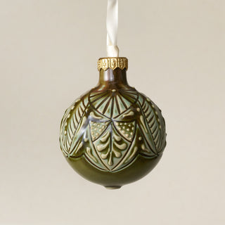 Intricately carved and glazed ceramic globe ornament with ivory satin ribbon – Ornament No. 446