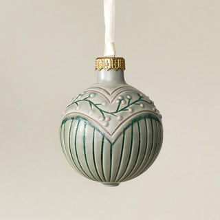 Intricately carved and glazed ceramic globe ornament with ivory satin ribbon – Ornament No. 449